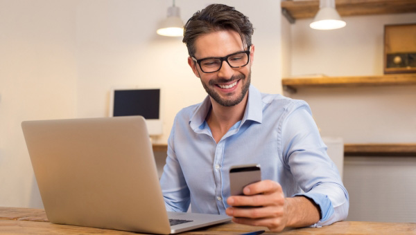 Man sitting looking at phone