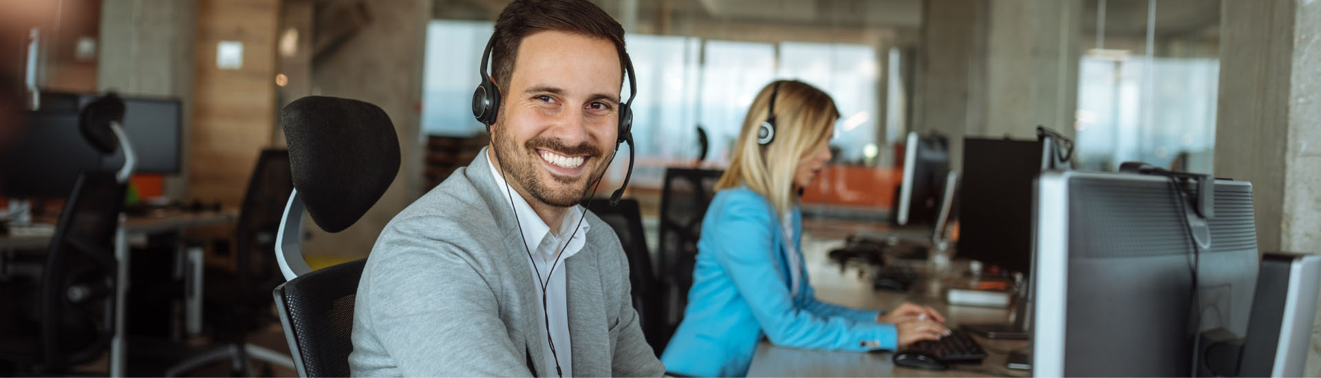 People working at desk smiling