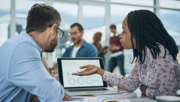 People collaborating on laptop