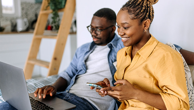 Couple looking at laptop together