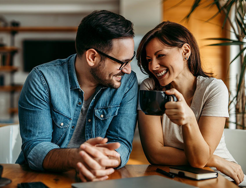 Happy couple checking phone