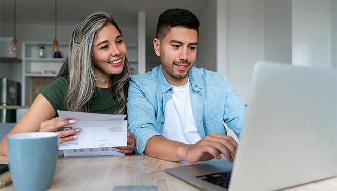 Couple looking at laptop together