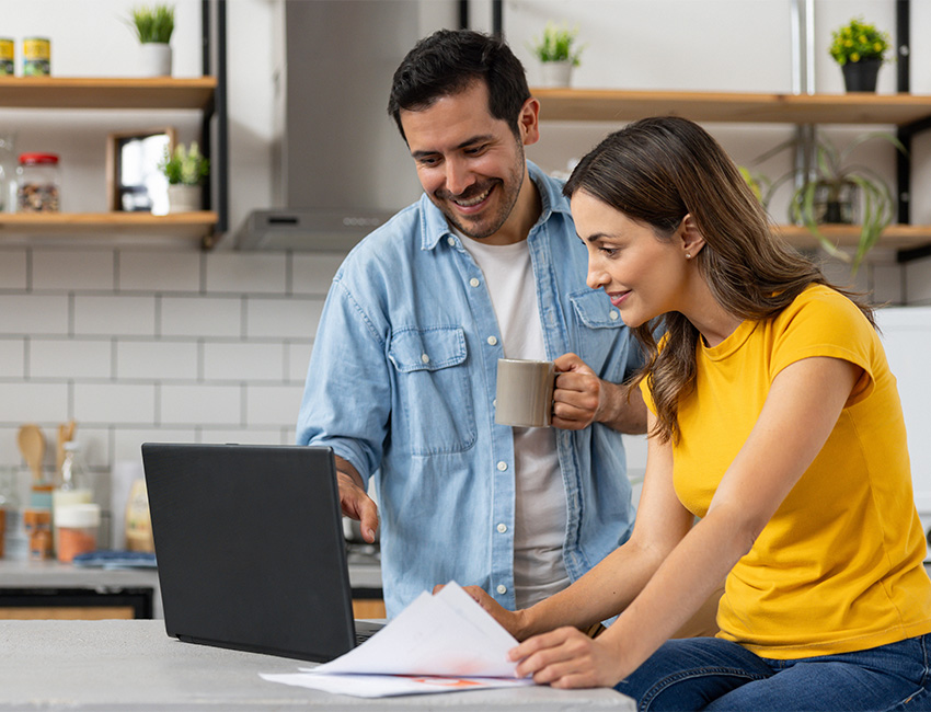 Couple reviewing laptop
