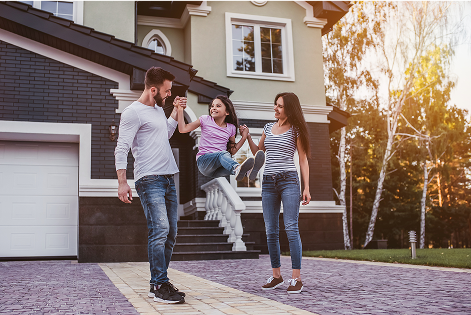 Family standing in front of their house