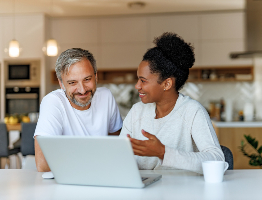 Mature couple looking at laptop
