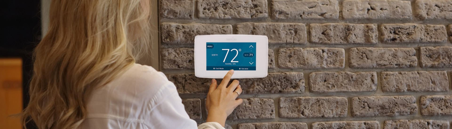 Smart Thermostats Lady Pressing Thermostat