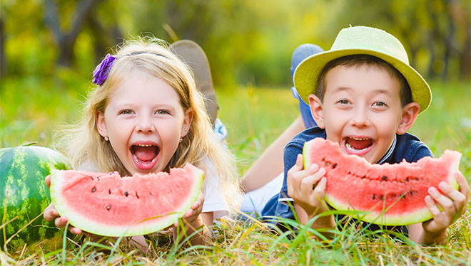 Kids eating watermelon
