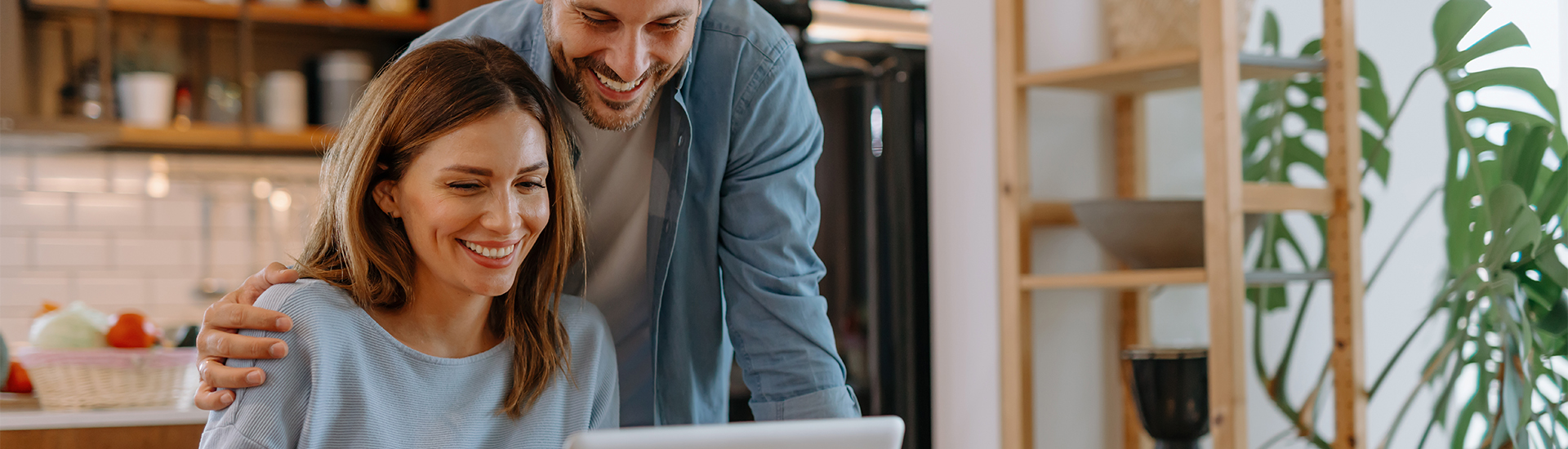 Couple browsing laptop