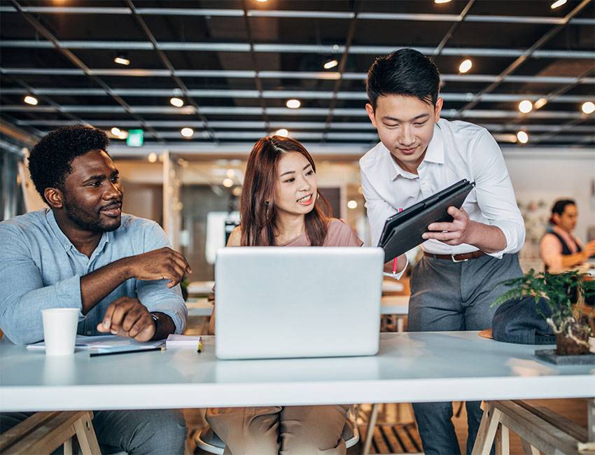 People working together looking at screens
