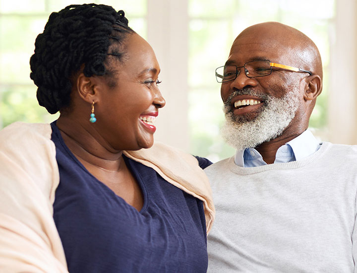 Happy couple checking phone