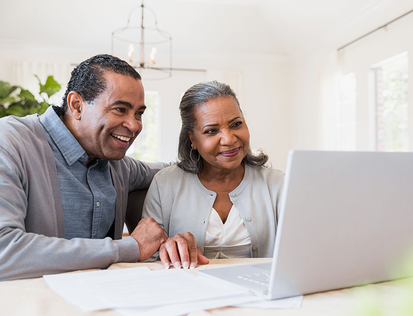 Couple using laptop
