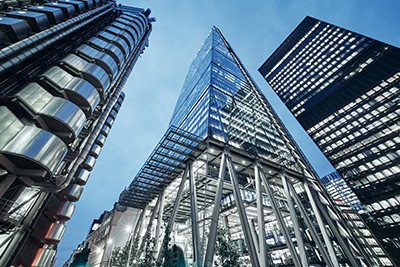 worms eye view of tall buildings on a clear day