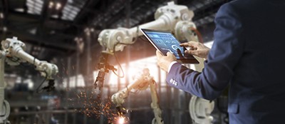 worker using an ipad in a factory