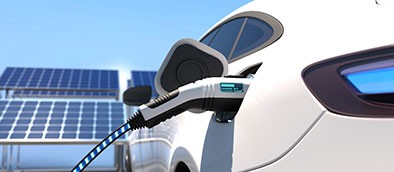 close up shot of ev car plugged into ev charging port