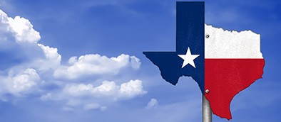 texas state flag against blue sky background