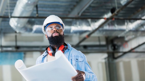 Engineer reviewing efficiency project plans